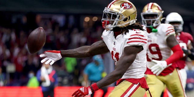 Brandon Aiyuk, #11 of the San Francisco 49ers, celebrates after scoring a touchdown against the Arizona Cardinals during the third quarter at Estadio Azteca on Nov. 21, 2022 in Mexico City.