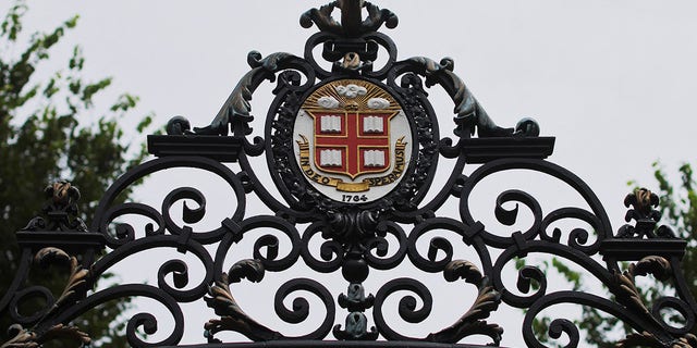 The seal of Brown University adorns the Van Wickle Gates at the edge of the main campus in Providence, Rhode Island, Aug. 16, 2022.