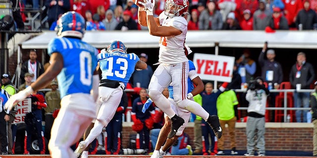 Cameron Latu (81) of the Alabama Crimson Tide catches a touchdown during the first half against the Mississippi Rebels at Vaught-Hemingway Stadium Nov. 12, 2022, in Oxford, Miss.