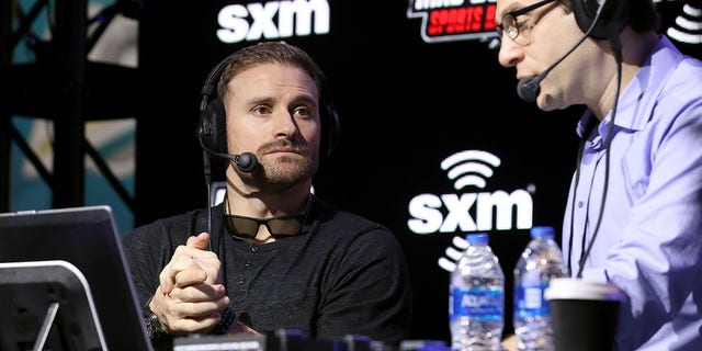 Former NFL player, Chris Long and SiriusXM host Adam Schein speak onstage during day 2 of SiriusXM at Super Bowl LIV on Jan. 30, 2020 in Miami.