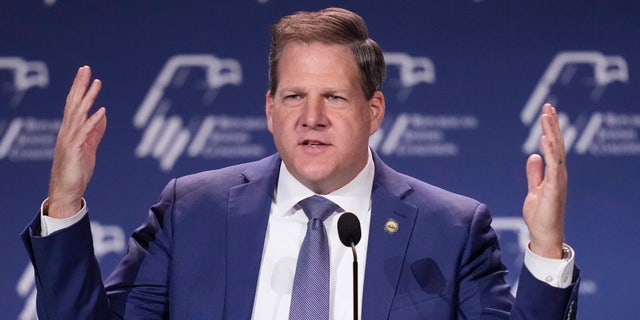 New Hampshire Gov. Chris Sununu speaks at an annual leadership meeting of the Republican Jewish Coalition Saturday, Nov. 19, 2022, in Las Vegas. 