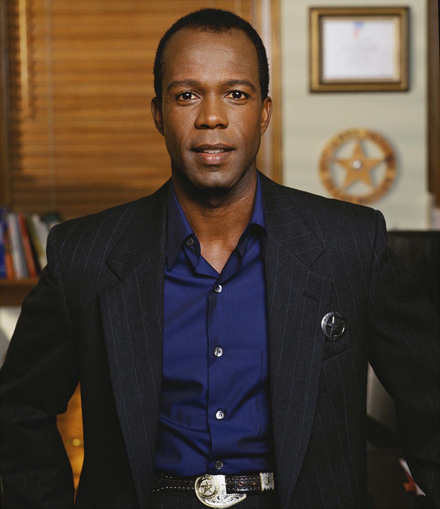 Promotional portrait of American actor Clarence Gilyard Jr. (as James 'Jimmy' Trivette), dressed in a pin-stripe suit, for the television series "Walker, Texas Ranger."