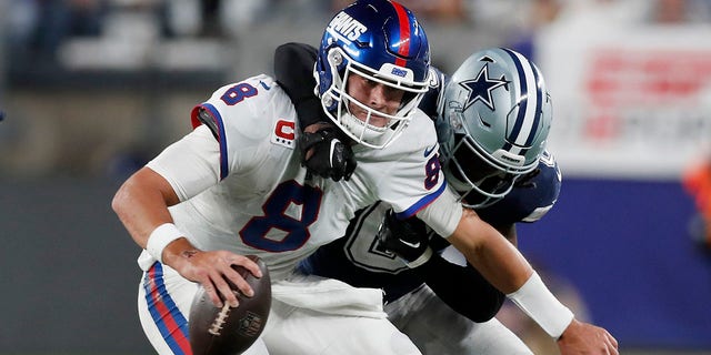 Donovan Wilson of the Dallas Cowboys takes down Daniel Jones (8) of the New York Giants at MetLife Stadium Sept. 26, 2022, in East Rutherford, N.J. The Cowboys defeated the Giants 23-16.