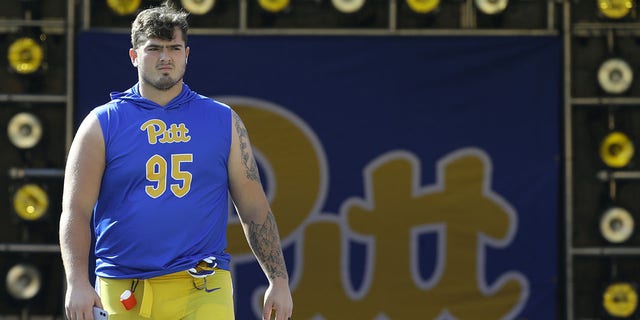 Pittsburgh Panthers defensive lineman Devin Danielson, #95, walks onto the fielded before the game against the Western Michigan Broncos at Heinz Field in Pittsburgh Sept. 18, 2021.