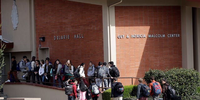 Students walk between buildings at St. Francis High School in Mountain View, California.