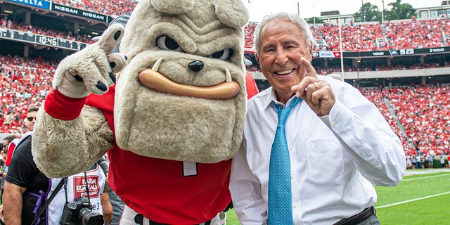 Georgia Bulldogs mascot Hairy Dawg with Lee Corso before an NCAA football game between the Arkansas Razorbacks and Georgia Bulldogs Oct. 2, 2021, at Sanford Stadium in Athens, Ga.