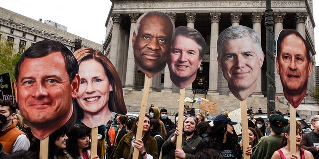 Demonstrators with signs of U.S. Supreme Court Justices during a pro-abortion protest in New York City on Tuesday, May 3, 2022. 