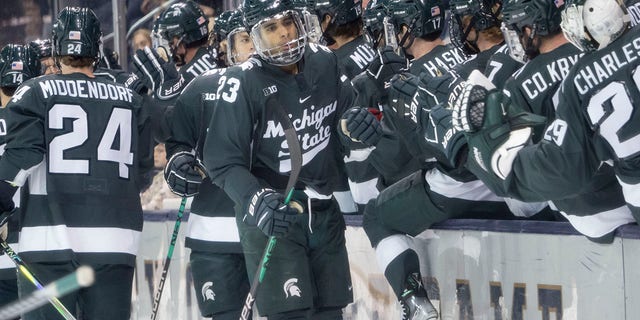 Michigan State Spartans forward Jagger Joshua, #23, celebrates after scoring a goal during a men's college hockey game between the Michigan State Spartans and the Notre Dame Fighting Irish on Oct. 29, 2022 at the Compton Family Ice Arena in South Bend, Indiana.