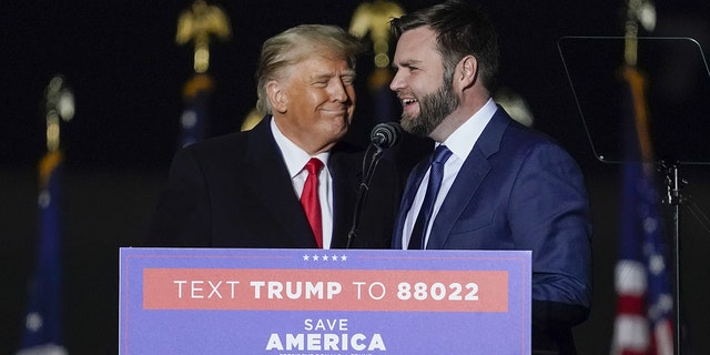 JD Vance, co-founder of Narya Capital Management LLC and US Republican Senate candidate for Ohio, right, talks on stage with former US President Donald Trump during a 'Save America' rally in Vandalia, Ohio, US, on Monday, Nov. 7, 2022.