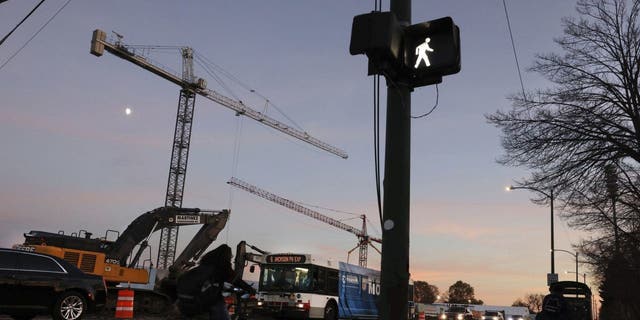 Traffic maneuvers past the construction site for the Obama Presidential Center in Chicago's Jackson Park neighborhood on Nov. 3, 2022.