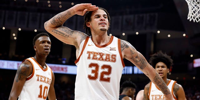 Texas forward Christian Bishop salutes the crowd after making a shot against the Gonzaga Bulldogs at the Moody Center on Nov. 16, 2022.