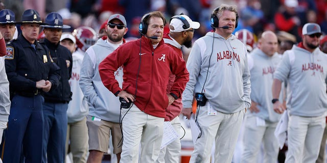 Alabama Crimson Tide head coach Nick Saban and offensive line coach Eric Wolford look on during a game against the Mississippi Rebels at Vaught-Hemingway Stadium in Oxford, Mississippi, on Saturday.