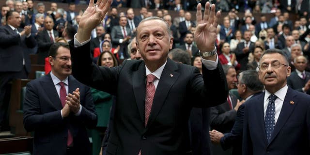 Turkish President and leader of the Justice and Development Party, Recep Tayyip Erdogan, is greeted by his party members before addressing a meeting at the Turkish Grand National Assembly in Ankara on Nov 23, 2022.