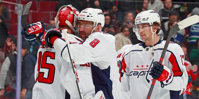 Alex Ovechkin and teammates celebrate their 5-1 win over the Vancouver Canucks on Nov. 29, 2022.