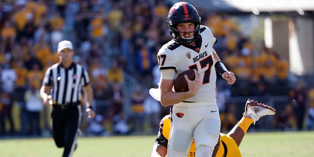 Defensive lineman B.J. Green II of the Arizona State Sun Devils tackles quarterback Ben Gulbranson (17) of the Oregon State Beavers during the first half at Sun Devil Stadium Nov. 19, 2022, in Tempe, Ariz. The Beavers beat the Sun Devils 31-7. 