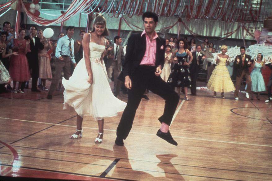 Olivia Newton-John and John Travolta as Sandy Olsson and Danny Zuko in "Grease" dancing.