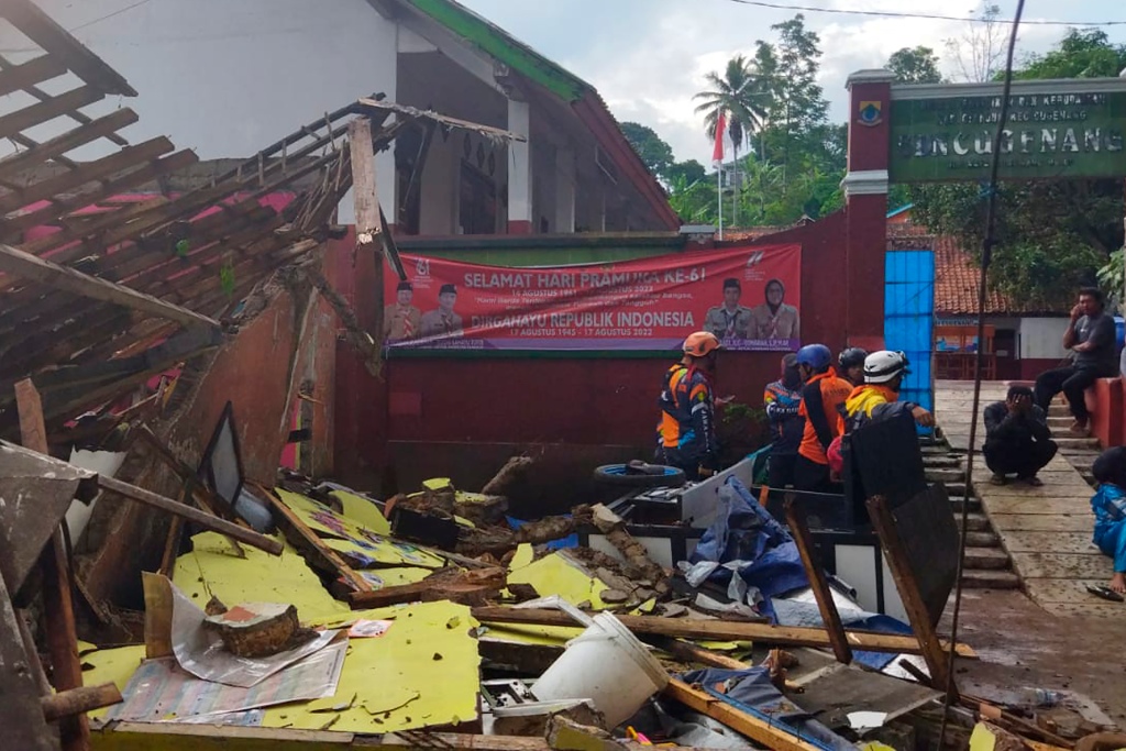 Rescuers inspect a school damaged by the earthquake in Cianjur, West Java, Indonesia.