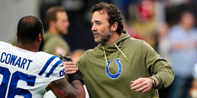 Indianapolis Colts interim head coach Jeff Saturday greets defensive tackle Byron Cowart before a game against the Las Vegas Raiders on Nov. 13, 2022.