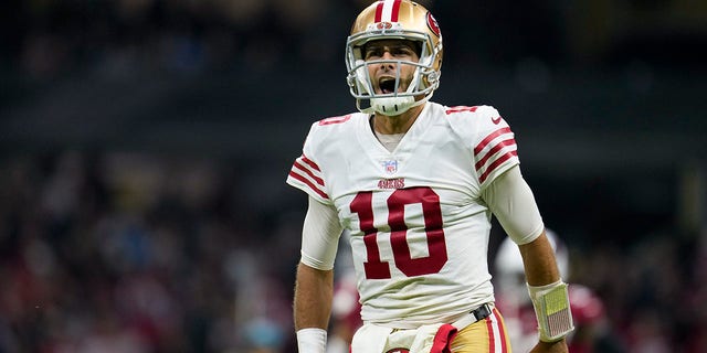 San Francisco 49ers quarterback Jimmy Garoppolo reacts after tight end George Kittle scored a touchdown during the second half of an NFL football game against the Arizona Cardinals, Monday, Nov. 21, 2022, in Mexico City.