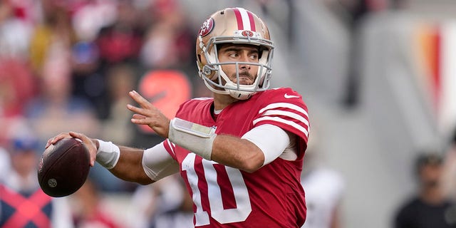 San Francisco 49ers quarterback Jimmy Garoppolo, #10, passes against the New Orleans Saints during the second half of an NFL football game in Santa Clara, California, Sunday, Nov. 27, 2022.