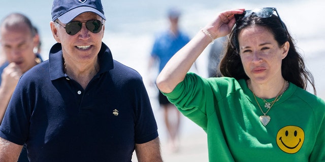 President Biden walks on the beach with his daughter, Ashley Biden, and members of his extended family in Rehoboth Beach, Delaware, June 20, 2022.