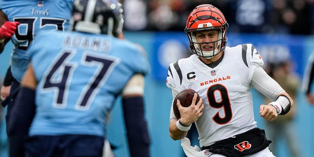 Cincinnati Bengals quarterback Joe Burrow (9) carries the ball against the Tennessee Titans during the first half, Nov. 27, 2022, in Nashville, Tennessee.