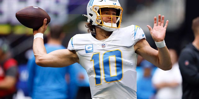 Los Angeles Chargers quarterback Justin Herbert warms up before a game against the Atlanta Falcons, Sunday, Nov. 6, 2022, in Atlanta. 