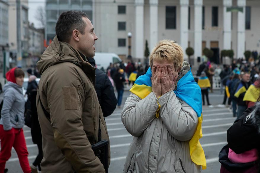 A woman reacts with Ukrainian lawmaker and officer Roman Kostenko as they celebrate the recapturing in Kherson