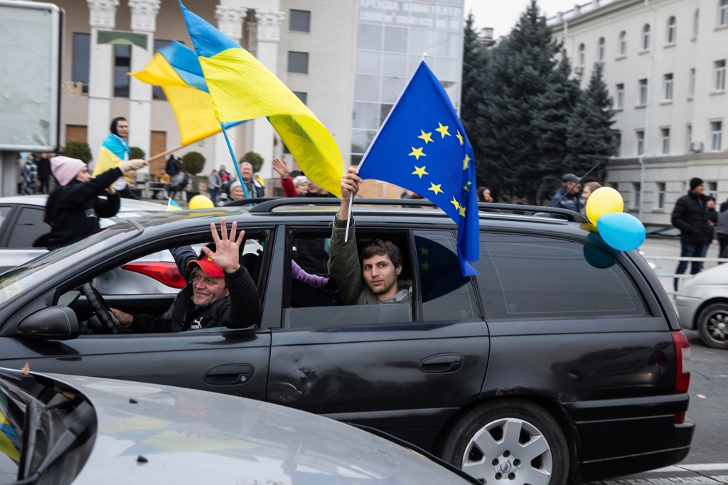 Ukrainian’s wave flags from cars in downtown Kherson, as celebrations break out over recapturing the city.