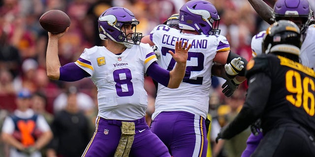 Minnesota Vikings quarterback Kirk Cousins (8) throws during the first half of a game against the Washington Commanders, Sunday, Nov. 6, 2022, in Landover, Md. 