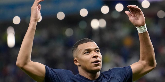 France's Kylian Mbappe celebrates after scoring against Australia during the World Cup group D soccer match between France and Australia, at the Al Janoub Stadium in Al Wakrah, Qatar, Tuesday, Nov. 22, 2022. 