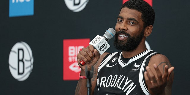 Brooklyn Nets guard Kyrie Irving talks to the media during media day at HSS Training Center.