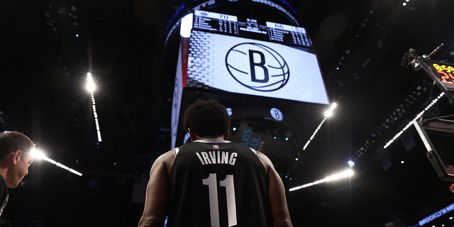 Kyrie Irving of the Brooklyn Nets in action against the Charlotte Hornets at Barclays Center March 27, 2022, in New York City.