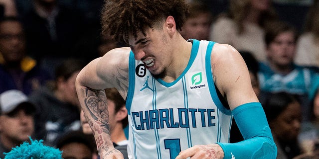 Charlotte Hornets guard LaMelo Ball reacts after being shaken up on a play during the second half of the team's NBA basketball game against the Indiana Pacers in Charlotte, North Carolina, Wednesday, Nov. 16, 2022. 