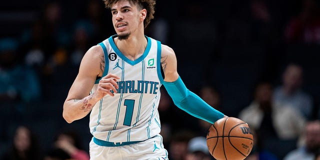 Charlotte Hornets guard LaMelo Ball brings the ball up during the first half of the team's NBA basketball game against the Indiana Pacers in Charlotte, North Carolina, Wednesday, Nov. 16, 2022. 