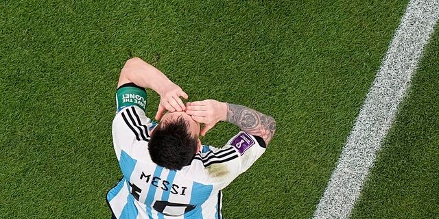 Argentina's Lionel Messi celebrates after scoring his side's opening goal during the World Cup group C soccer match between Argentina and Mexico, at the Lusail Stadium in Lusail, Qatar, Saturday, Nov. 26, 2022. 