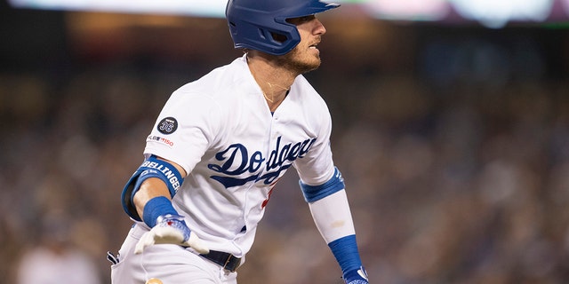 The Los Angeles Dodgers' Cody Bellinger tosses his bat after hitting a solo home run during the seventh inning of a game against the Chicago Cubs in Los Angeles June 13, 2019. 