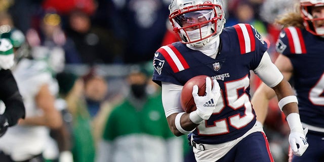 New England Patriots cornerback Marcus Jones (25) runs in a punt return for a touchdown during the second half of a game Nov. 20, 2022, in Foxborough, Mass.