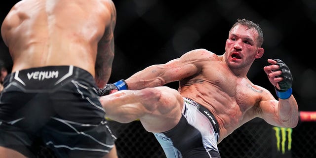 Michael Chandler kicks Dustin Poirier during their lightweight bout on Nov. 12, 2022, in Madison Square Garden.