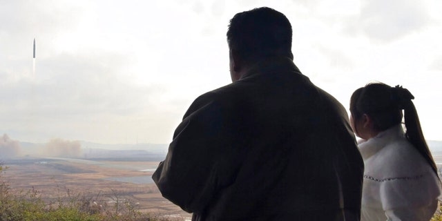 This photo provided on Nov. 19, 2022, by the North Korean government, shows North Korean leader Kim Jong Un, left, and his daughter at the site of what it says is a Hwasong-17 intercontinental ballistic missile at Pyongyang International Airport in Pyongyang, North Korea, Friday, Nov. 18, 2022. Independent journalists were not given access to cover the event depicted in this image. The content of this image is as provided and cannot be independently verified. 