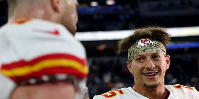 Patrick Mahomes #15 and Travis Kelce #87 of the Kansas City Chiefs celebrate a win over the Los Angles Chargers at SoFi Stadium on November 20, 2022 in Inglewood, California.