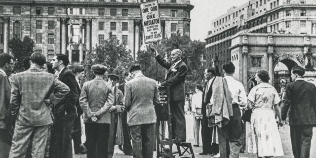 Open-air preaching has a long history in the U.K. Pictured is a Christian preacher at the entrance to Hyde Park in London in the 1930s.