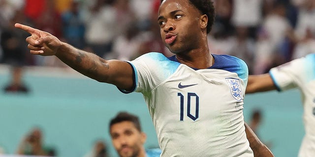 Raheem Sterling, of England, celebrates after scoring during a Group B match against Iran at the 2022 FIFA World Cup at Khalifa International Stadium in Doha, Qatar, Nov. 21, 2022.