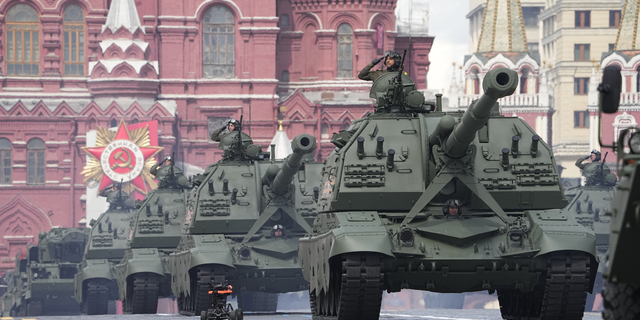 Russian self-propelled artillery vehicles roll during the Victory Day military parade in Moscow, Russia, May 9.