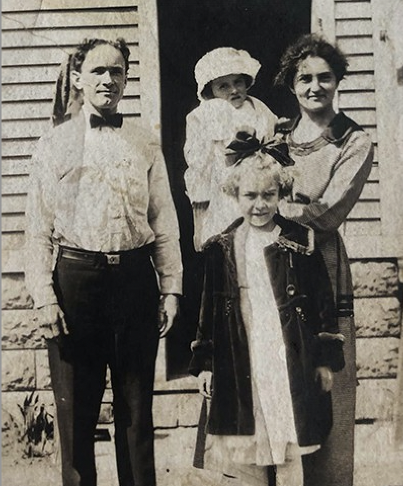 Bertha Krech, the preacher of the Plymouth Spiritualist Church in Rochester, NY, holds baby Violet alongside her husband Louis and elder daughter, Ilean, in the early 20th century.