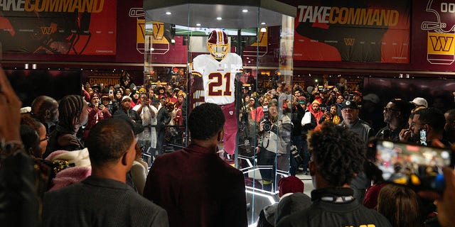 Fans attends the unveiling of the Sean Taylor Memorial, before the start of the Atlanta Falcons and Washington Commanders game, Sunday, Nov. 27, 2022, in Landover, Maryland.