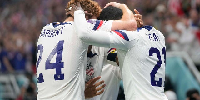 Tim Weah and his U.S. teammates celebrate after scoring during the World Cup against Wales at the Ahmad Bin Ali Stadium in Doha, Qatar, Monday, Nov. 21, 2022.