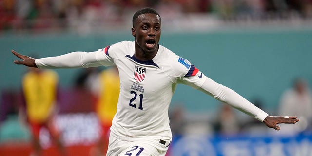 Tim Weah, of the United States, celebrates after scoring during a World Cup Group B soccer match against Wales at the Ahmad Bin Ali Stadium in Doha, Qatar, Monday, Nov. 21, 2022. 