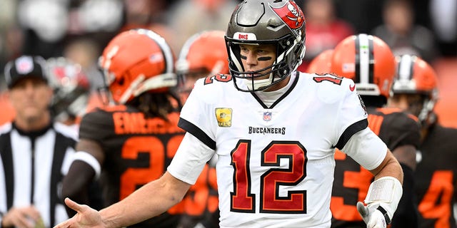 Tampa Bay Buccaneers quarterback Tom Brady celebrates a touchdown pass to wide receiver Chris Godwin Sunday, Nov. 27, 2022, in Cleveland.