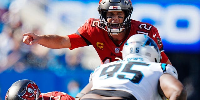 Tampa Bay Buccaneers quarterback Tom Brady (12) directs his team during the second half of an NFL football game against the Carolina Panthers Sunday, Oct. 23, 2022, in Charlotte, N.C.